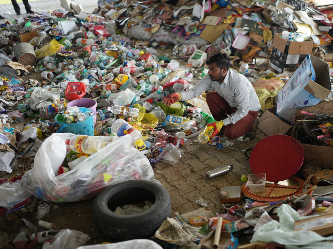 Waste collector Gopal segregating dry waste in village Hardaspur before it goes to a recycling plant.