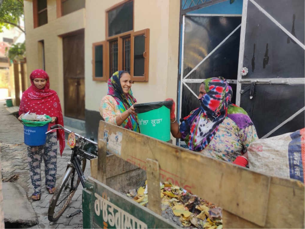 Waste collector Sher Kaur on duty at village Jhiurheri.